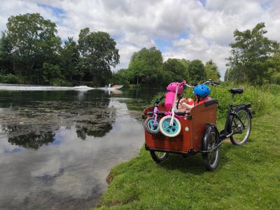 Vincent's Babboe cargo bike and kids at the park. 
